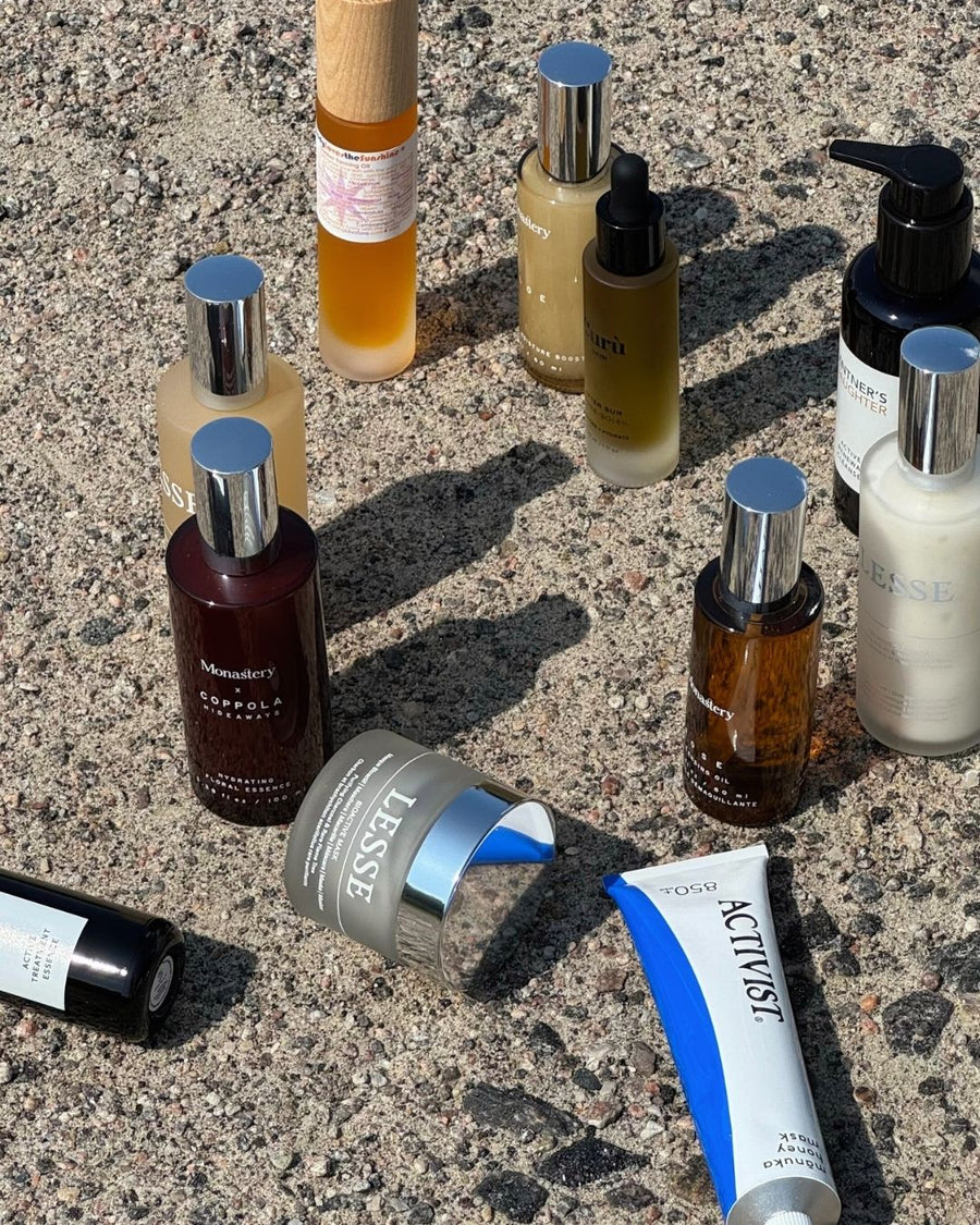 Clean aftersun skincare, bottles, jars and tubes against a neutral ground